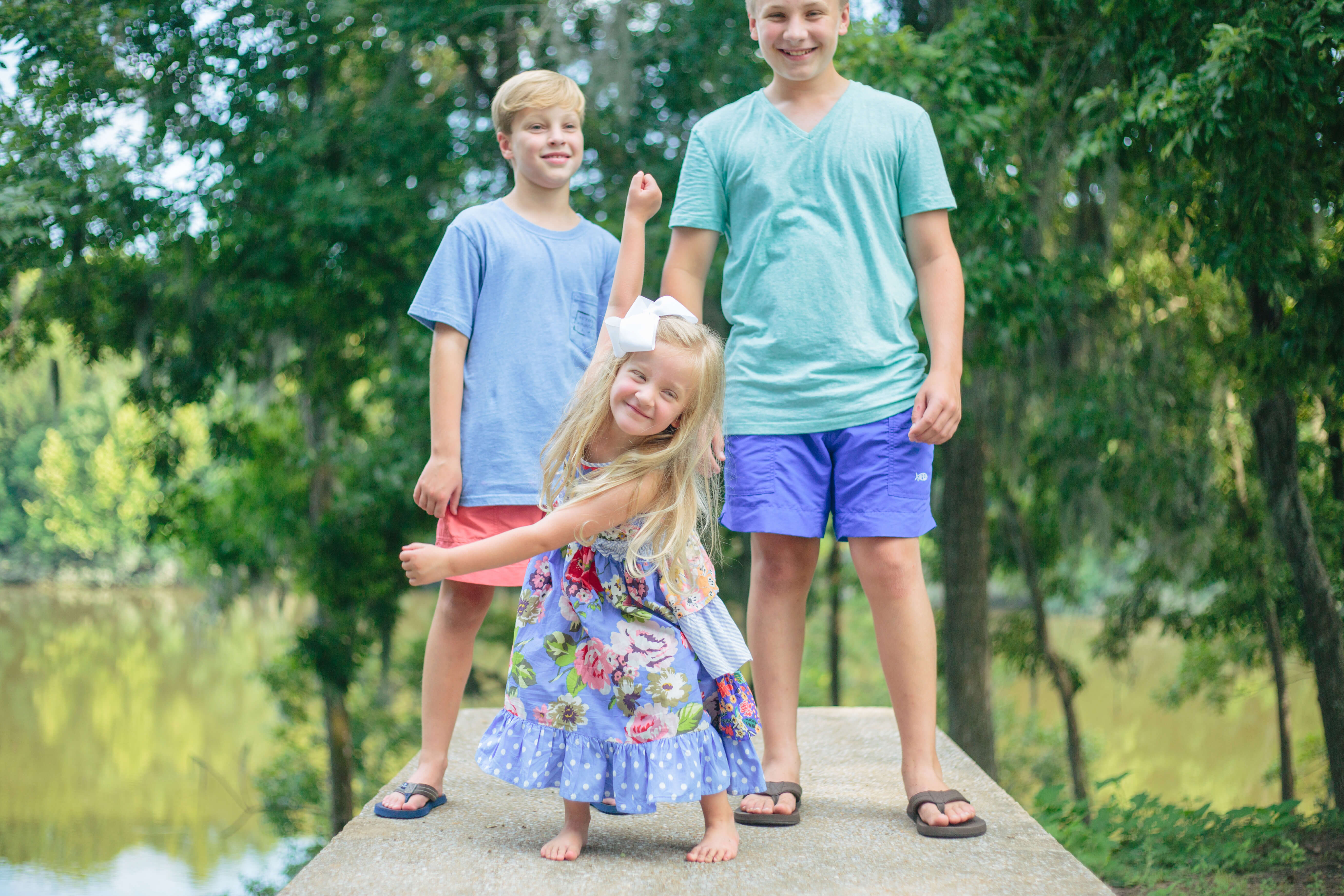 little sister being silly during family portrait session in millbrook